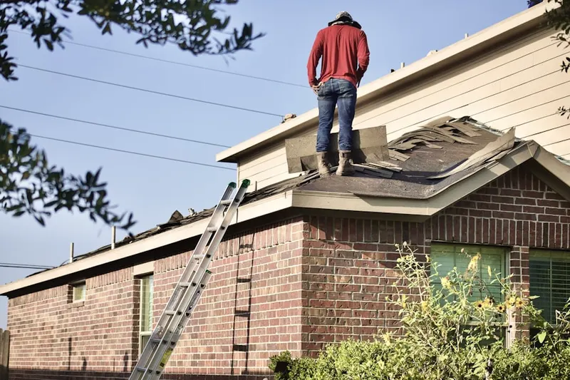 Professional roofer working on a residential roof in Hornsby Bend